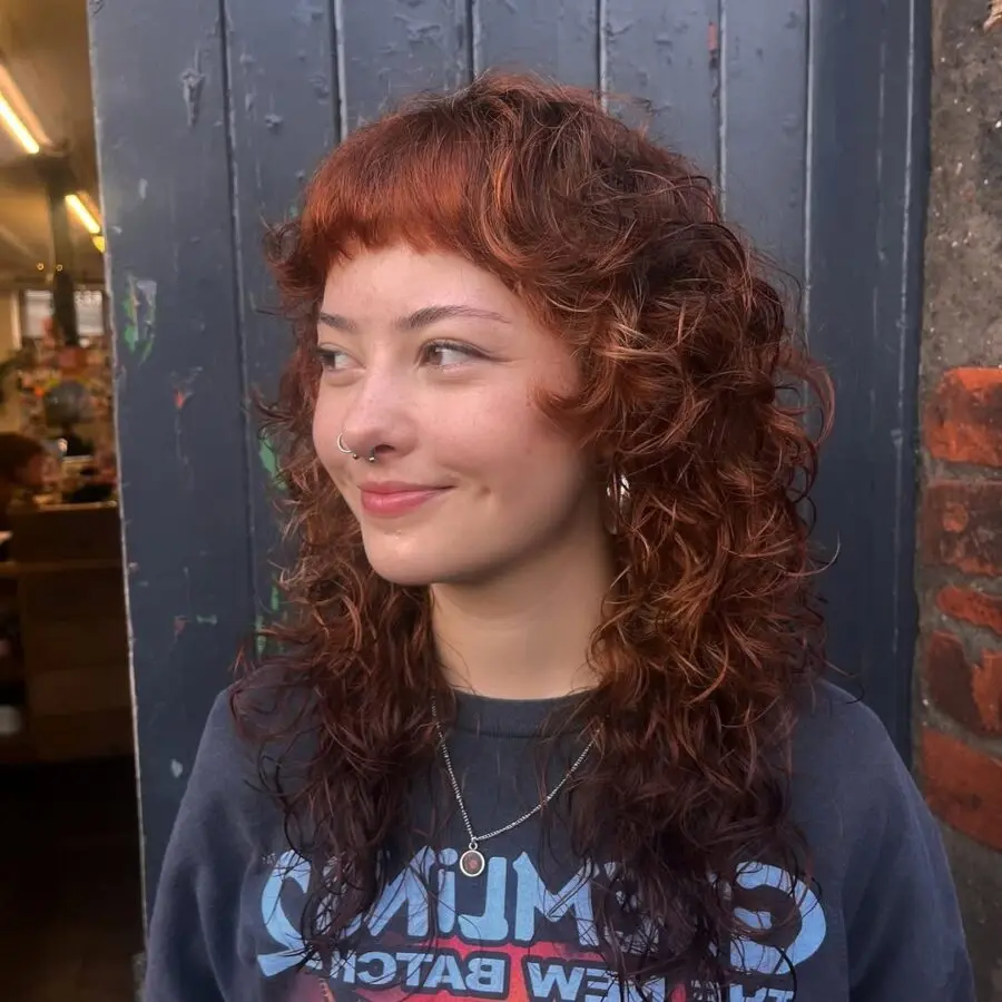 Vibrant short curly shag with bold bangs