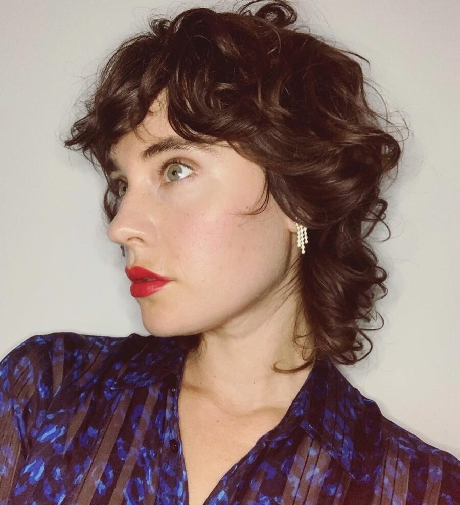 Stylish short curly shag hairstyle with flair