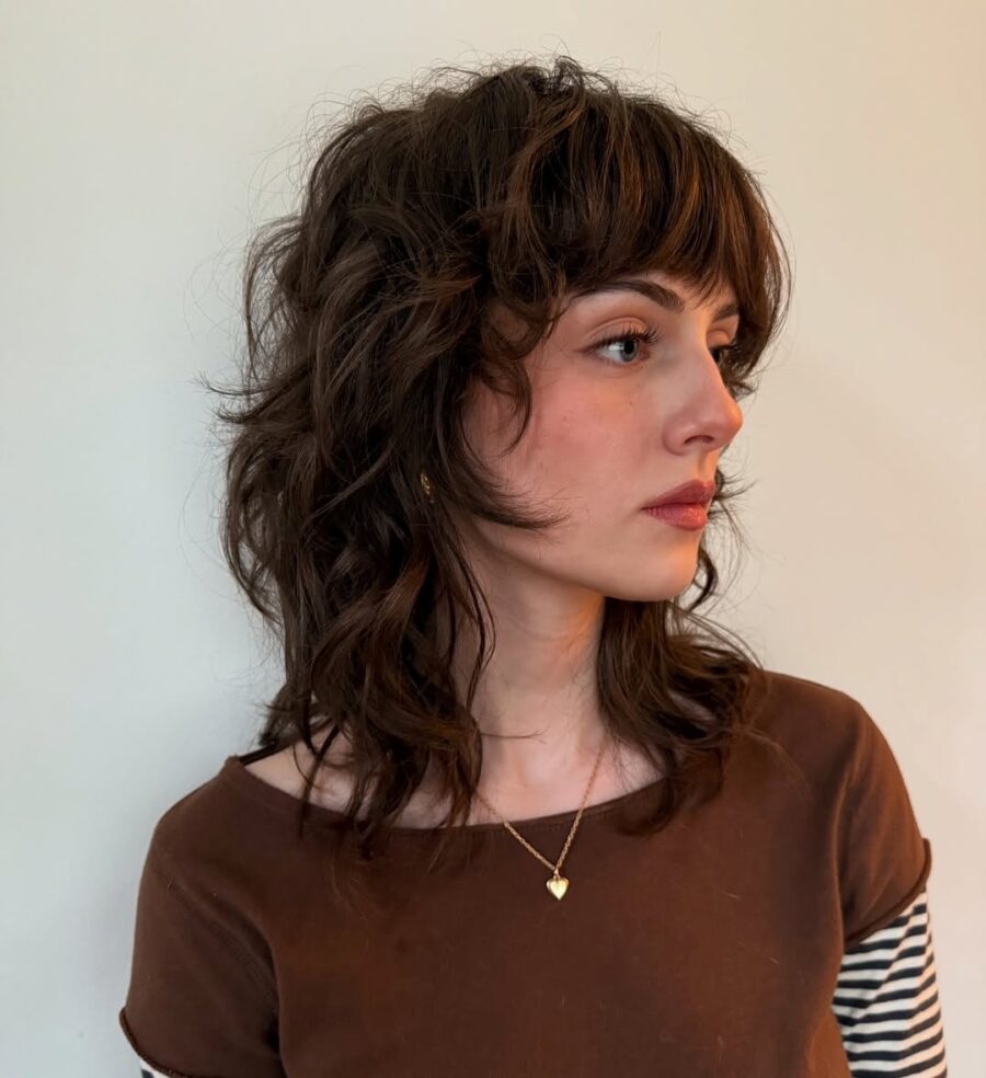 Chic short curly shag with trendy bangs