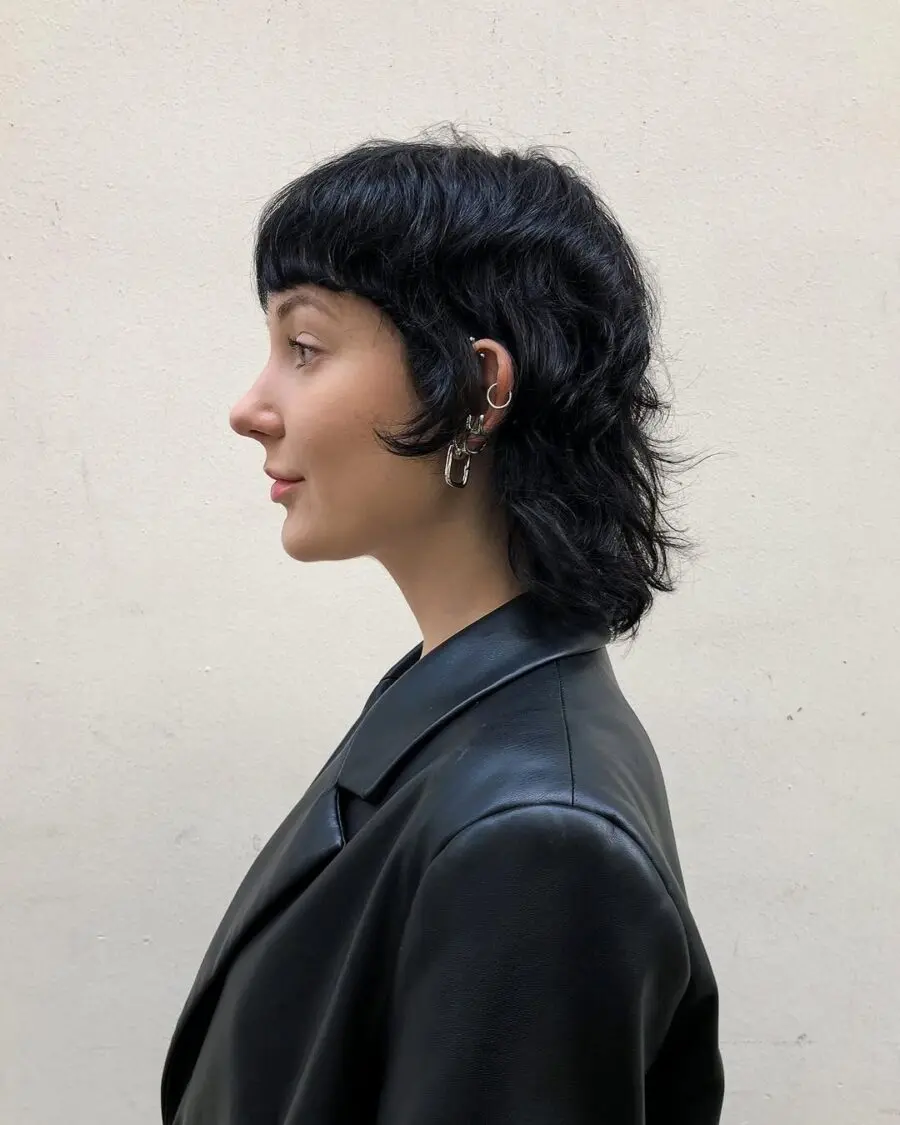 Chic short curly shag hairstyle in profile