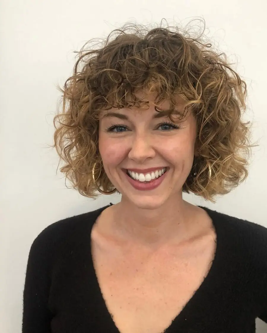 Trendy short curly shag hairstyle for a fresh look
