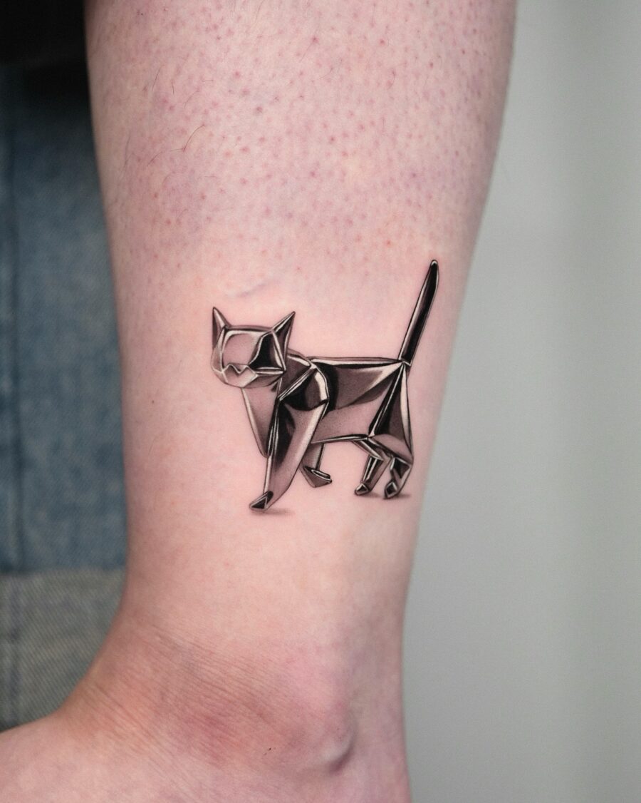 Elegant cat tattoo in silver ink design