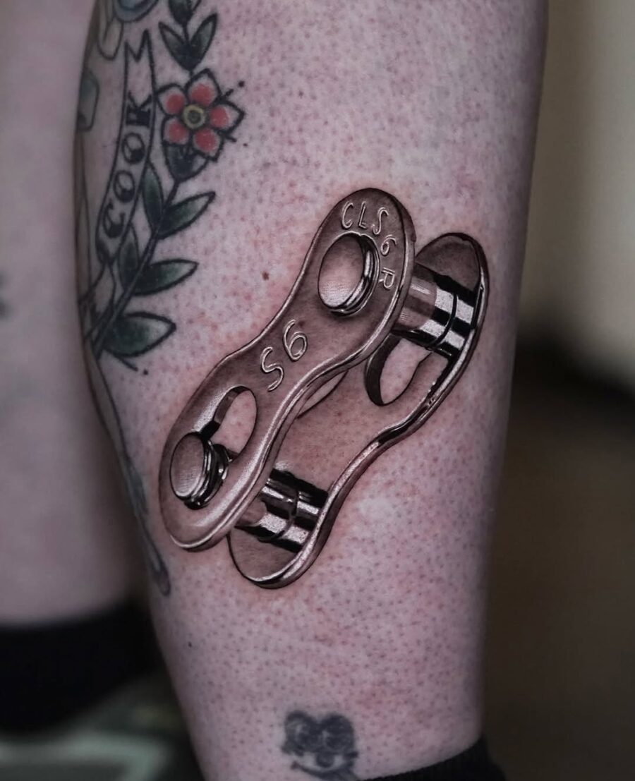 Intricate silver ink chain link tattoo design