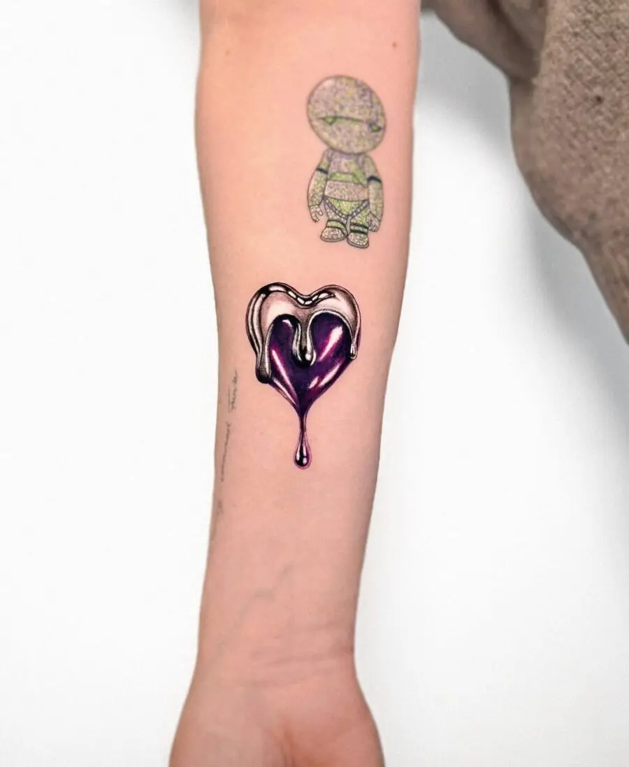 Dripping silver ink heart tattoo concept
