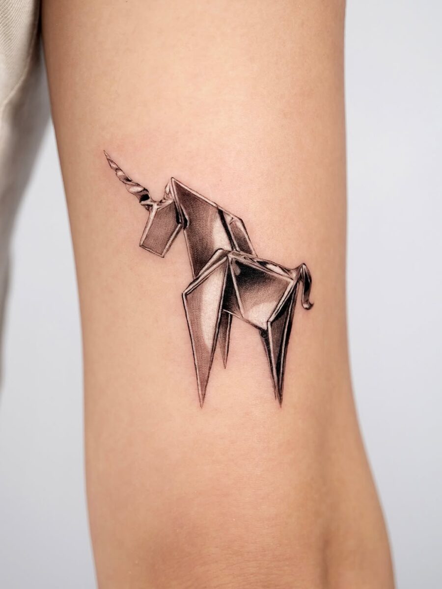 Whimsical origami unicorn in silver ink
