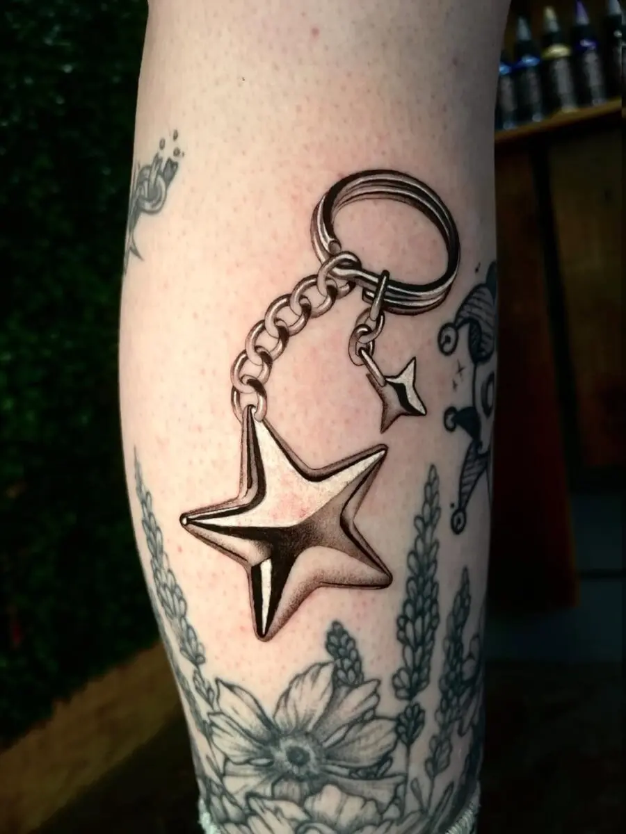 Stylish silver star keychain tattoo design