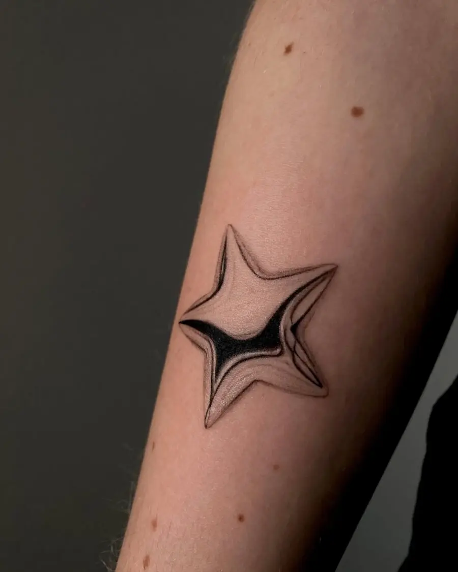 Stunning silver star tattoo on forearm