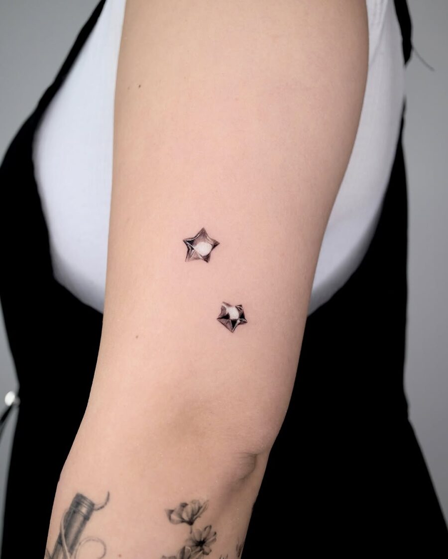 Stylish silver ink stars on skin