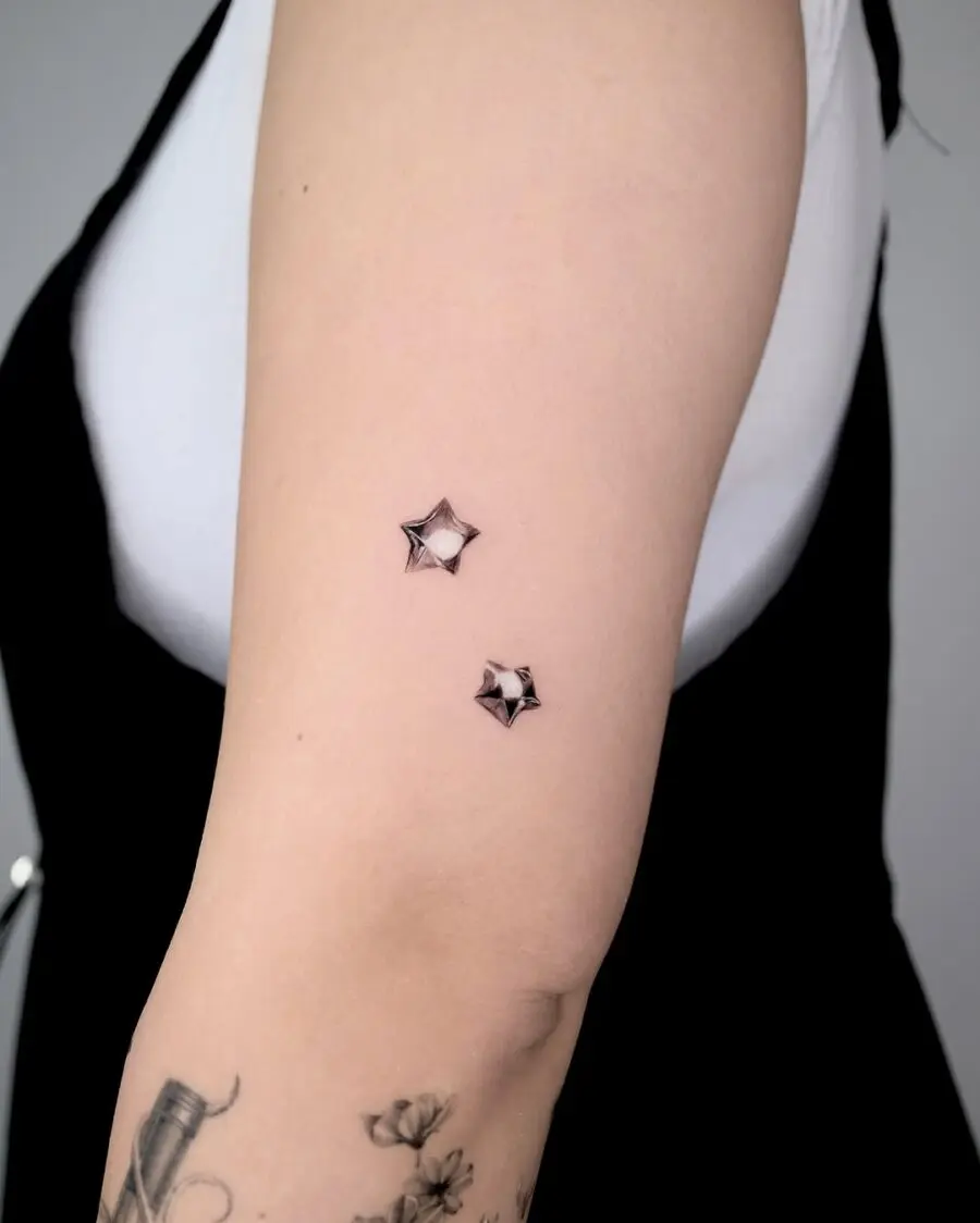 Stylish silver ink stars on skin