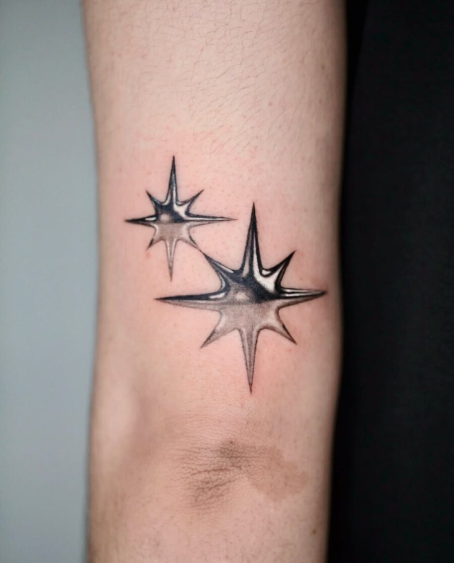 Striking Silver Ink Starburst Tattoos on Skin