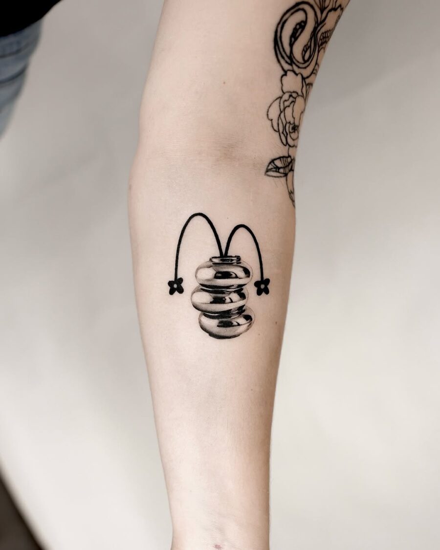 Unique silver ink bouncing design tattoo.