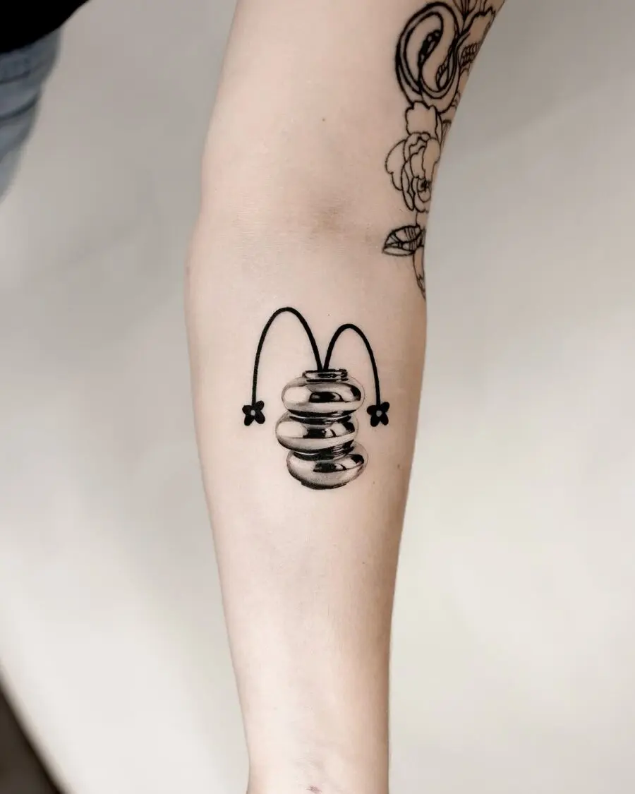 Unique silver ink bouncing design tattoo.