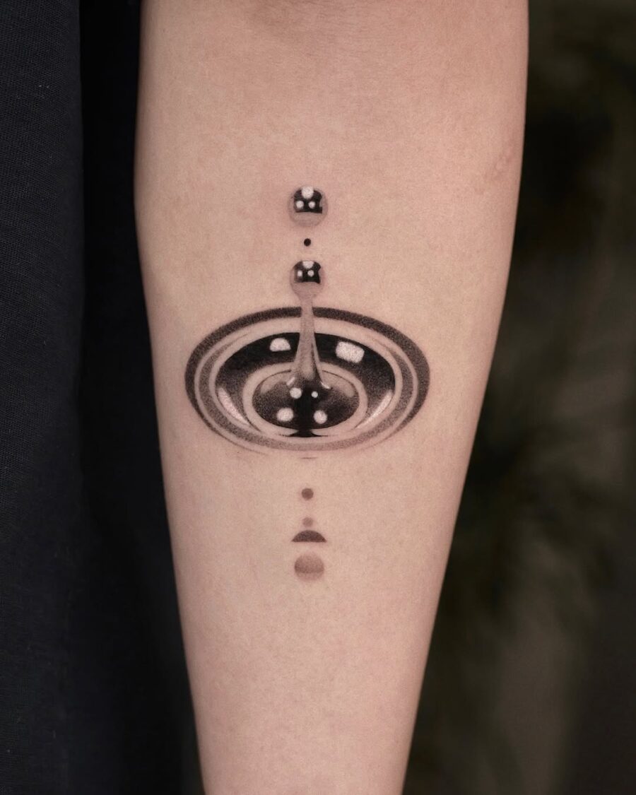 Intricate cosmic silver ink tattoo design