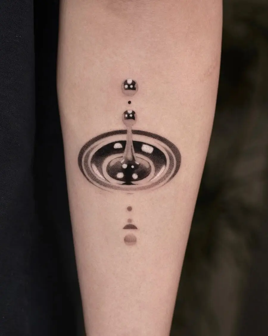 Intricate cosmic silver ink tattoo design