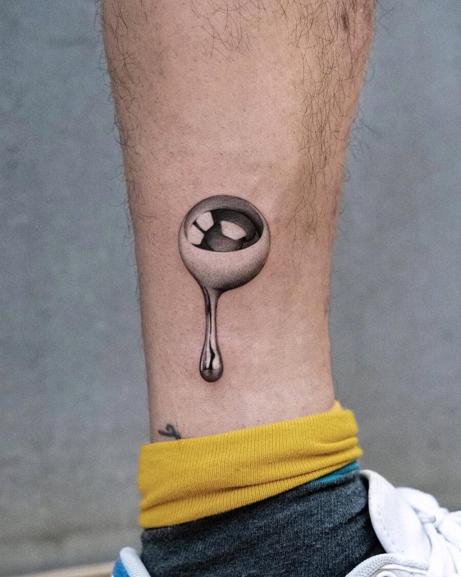Elegant silver ink tattoo with a unique drip effect