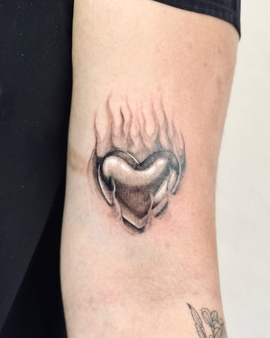 Elegant heart tattoo with flames design