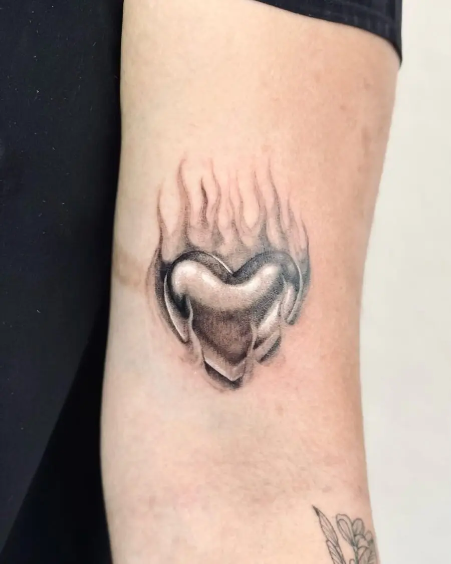 Elegant heart tattoo with flames design