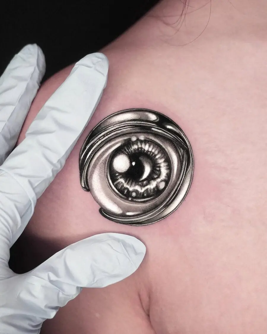 Intricate silver ink eye tattoo design