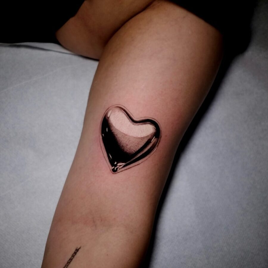 Stunning silver heart tattoo with a glossy finish