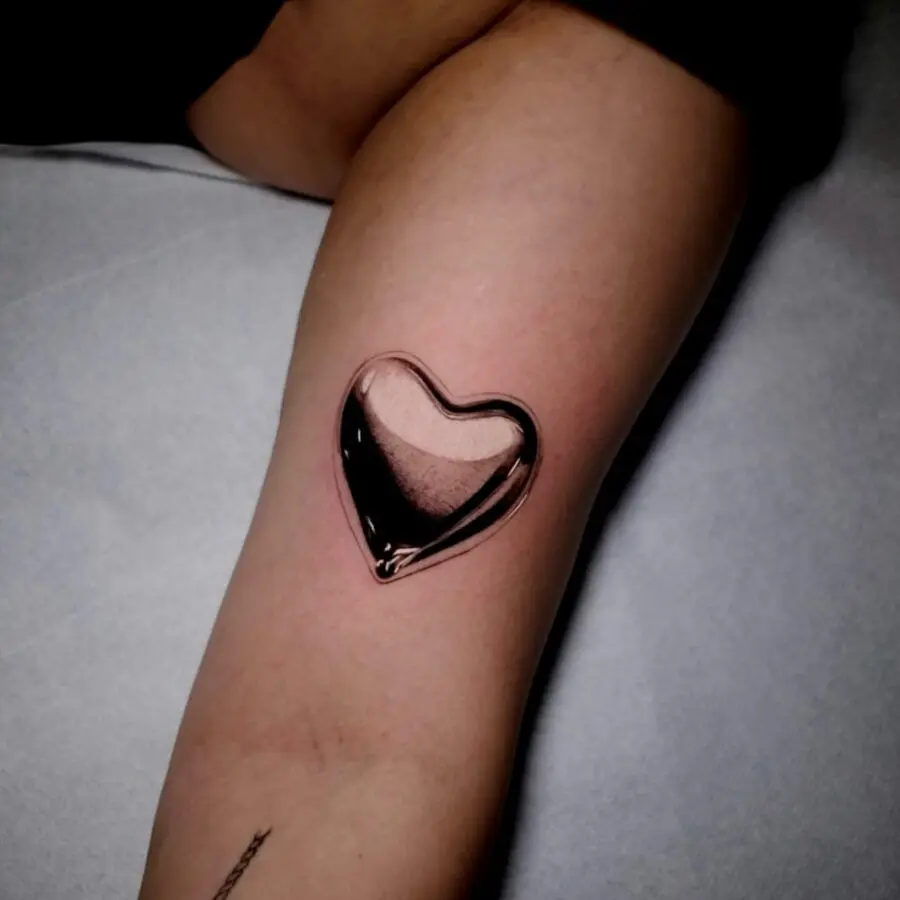 Stunning silver heart tattoo with a glossy finish