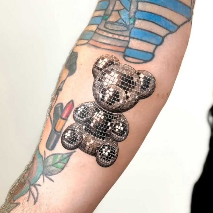 Shiny silver teddy bear tattoo design and vibe
