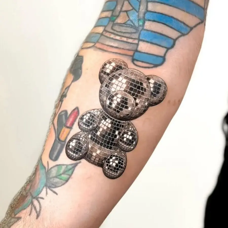 Shiny silver teddy bear tattoo design and vibe