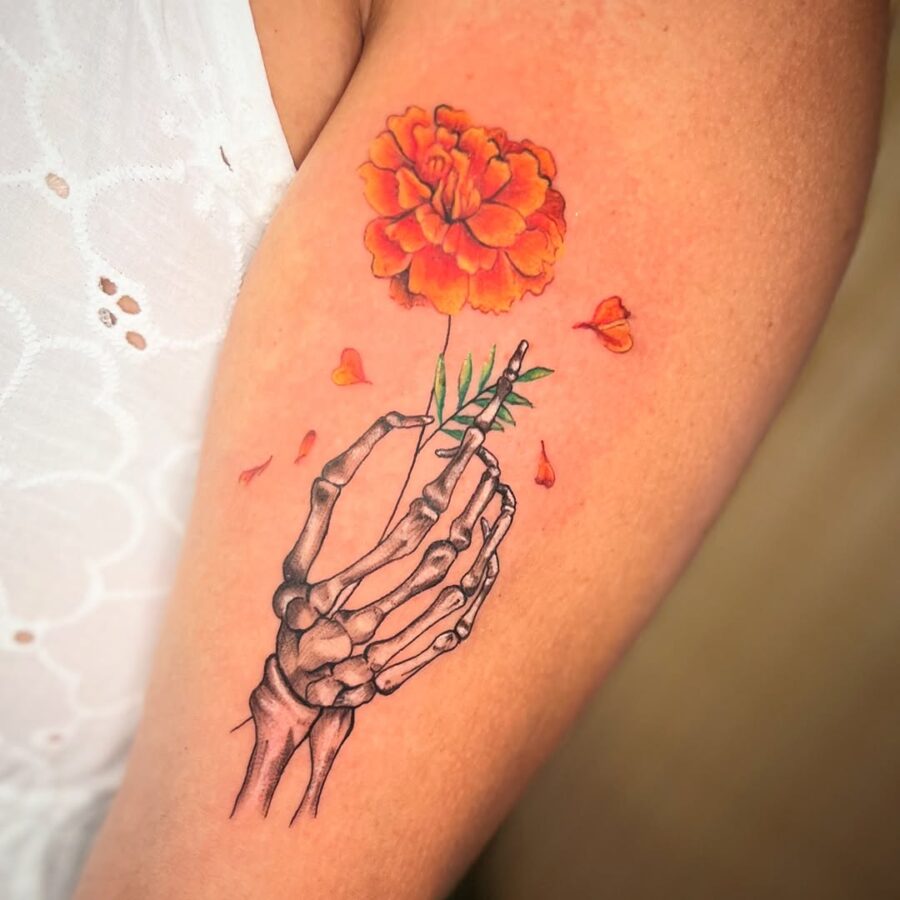 Unique skeleton hand bouquet tattoo design