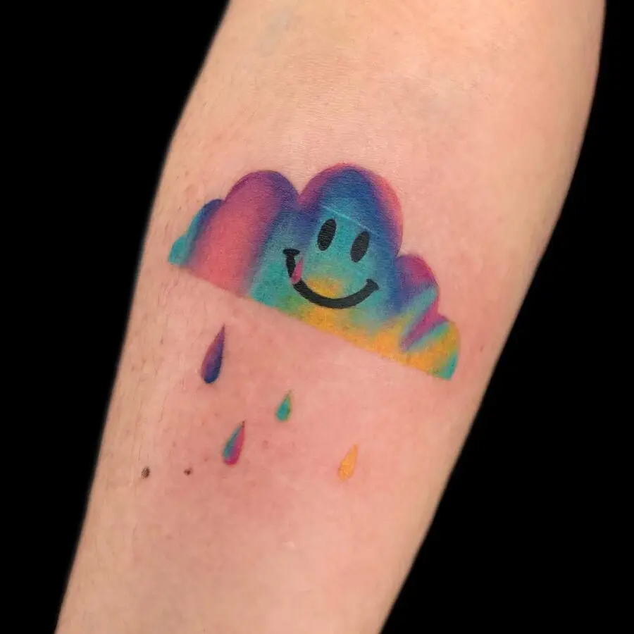 Joyful smiley cloud tattoo with rainbow hues