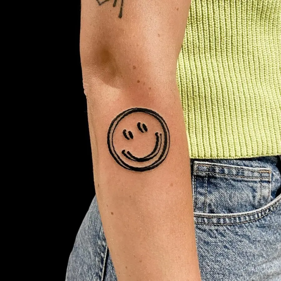 Charming smiley face tattoo radiating positivity
