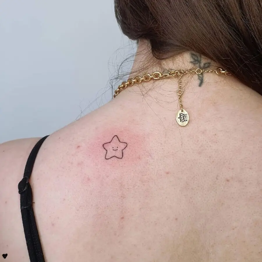 Minimalist star tattoo for a playful vibe