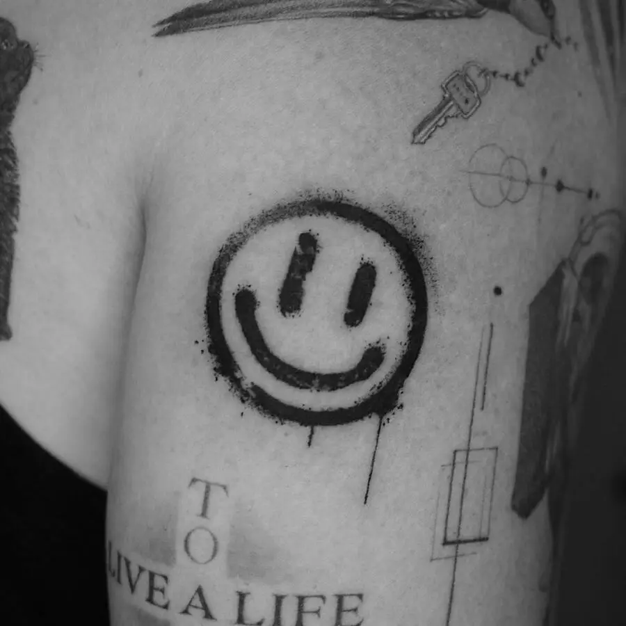 Bold Smiley Face Tattoo in Black Ink