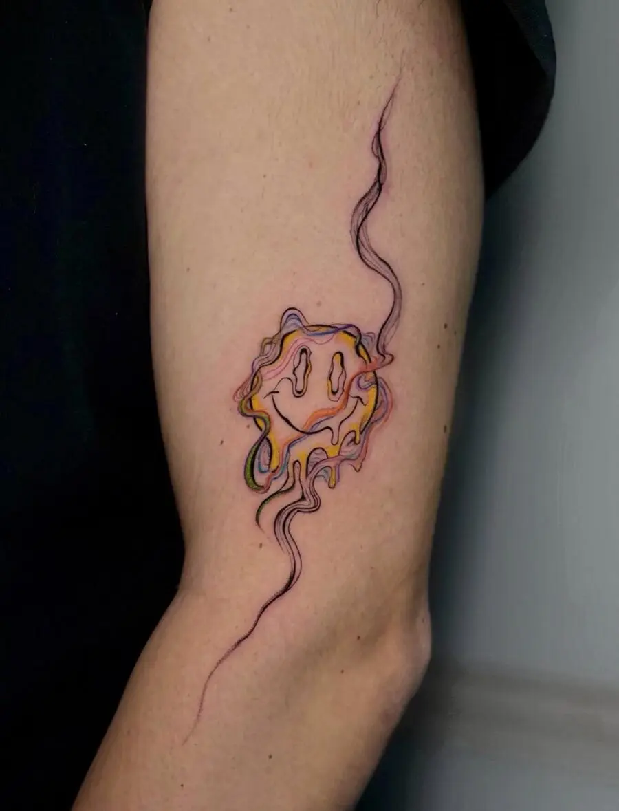 Vibrant Smiley Face Tattoo with Swirling Lines