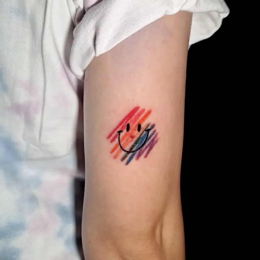 Vibrant Smiley Face Tattoo with a Colorful Splash