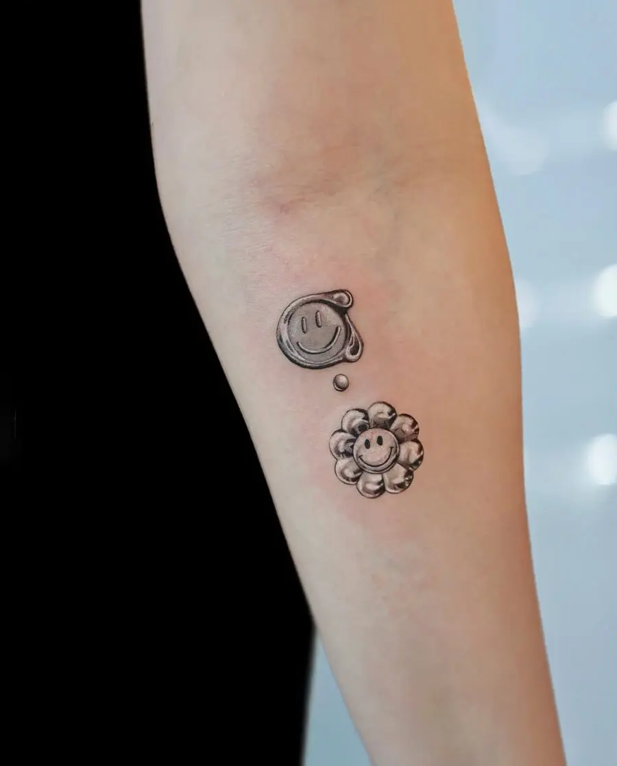 Charming smiley and flower tattoo combination