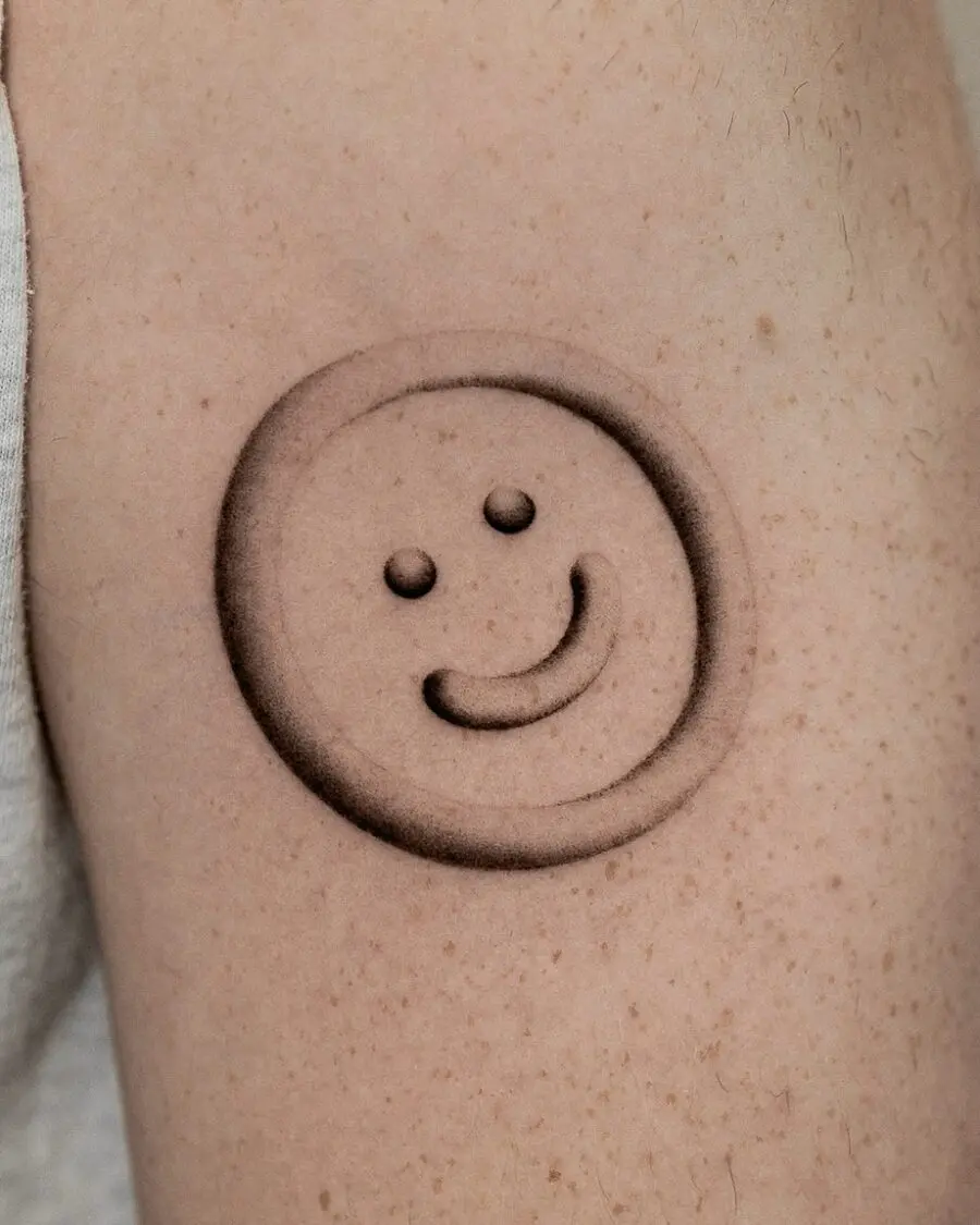Charming minimalist smiley face tattoo