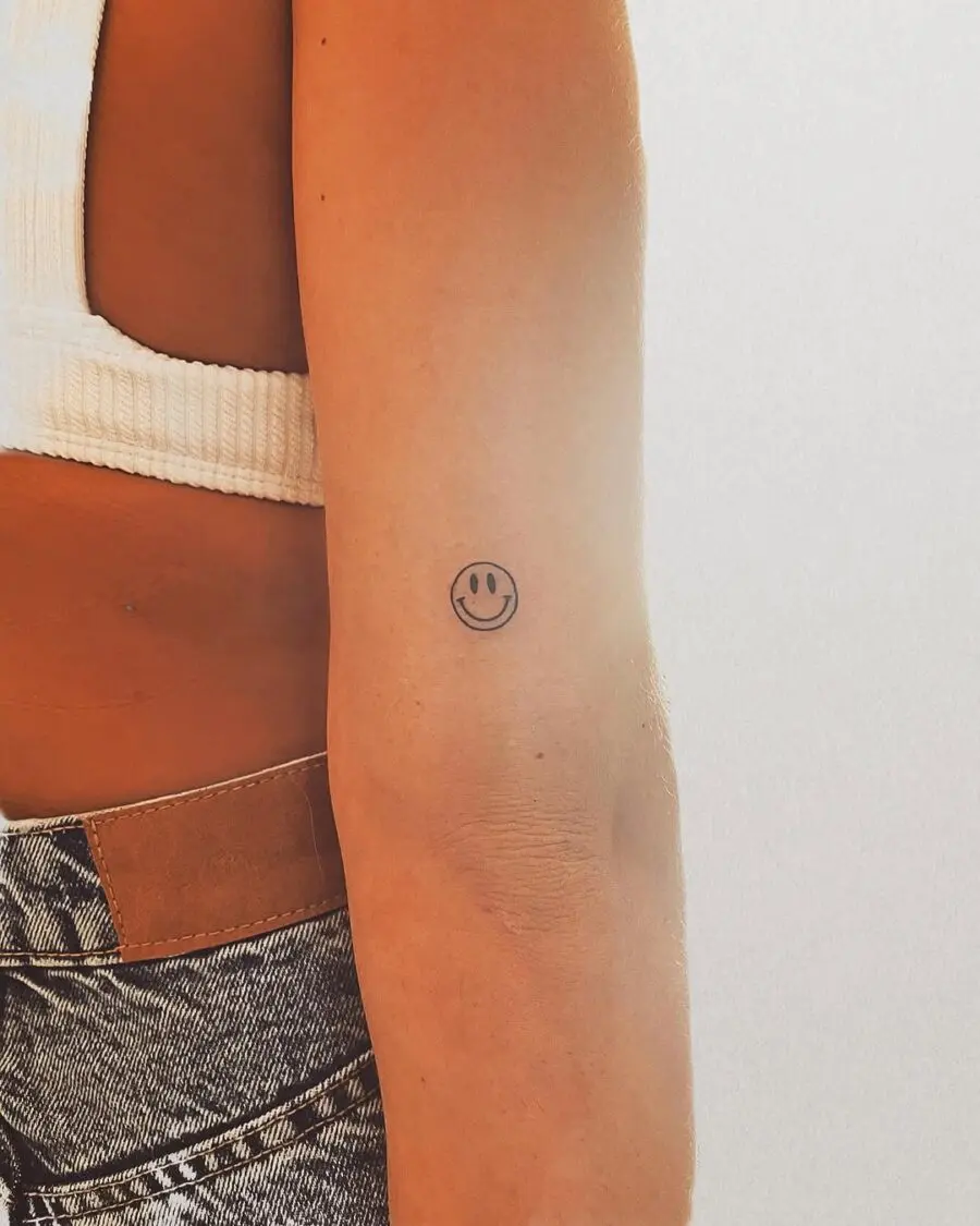 Charming Smiley Face Tattoo on Arm