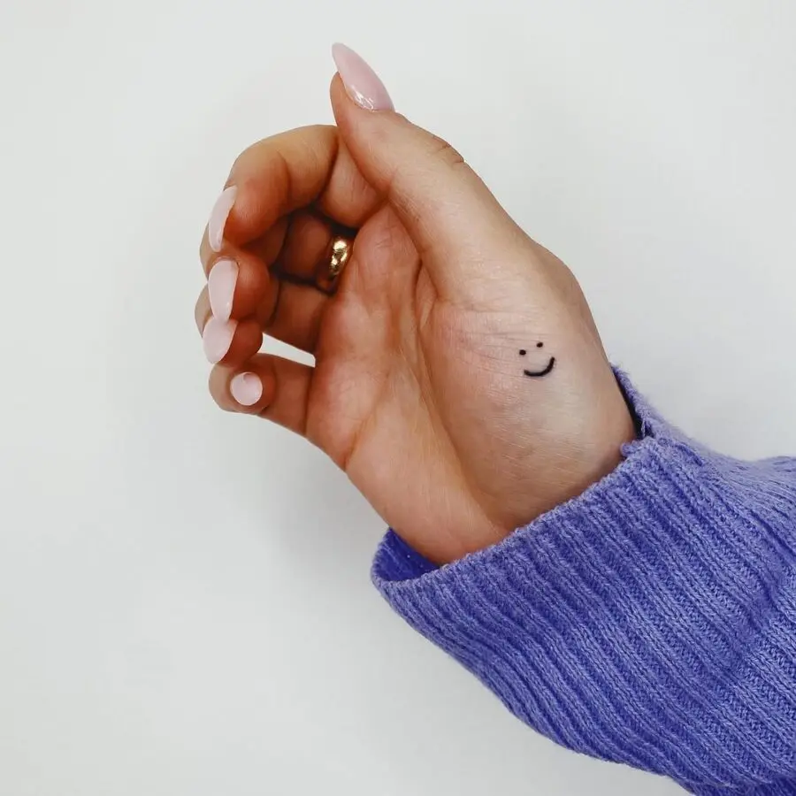 Minimalistic Smiley Face Tattoo on Hand
