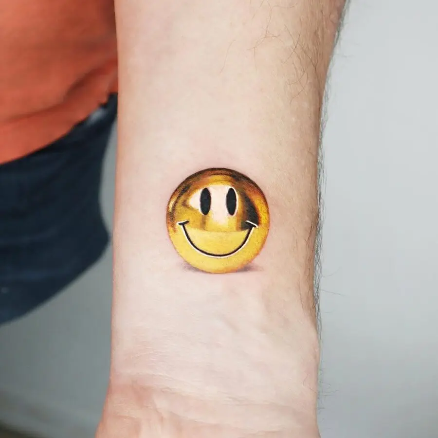 Charming and cheerful smiley face tattoo