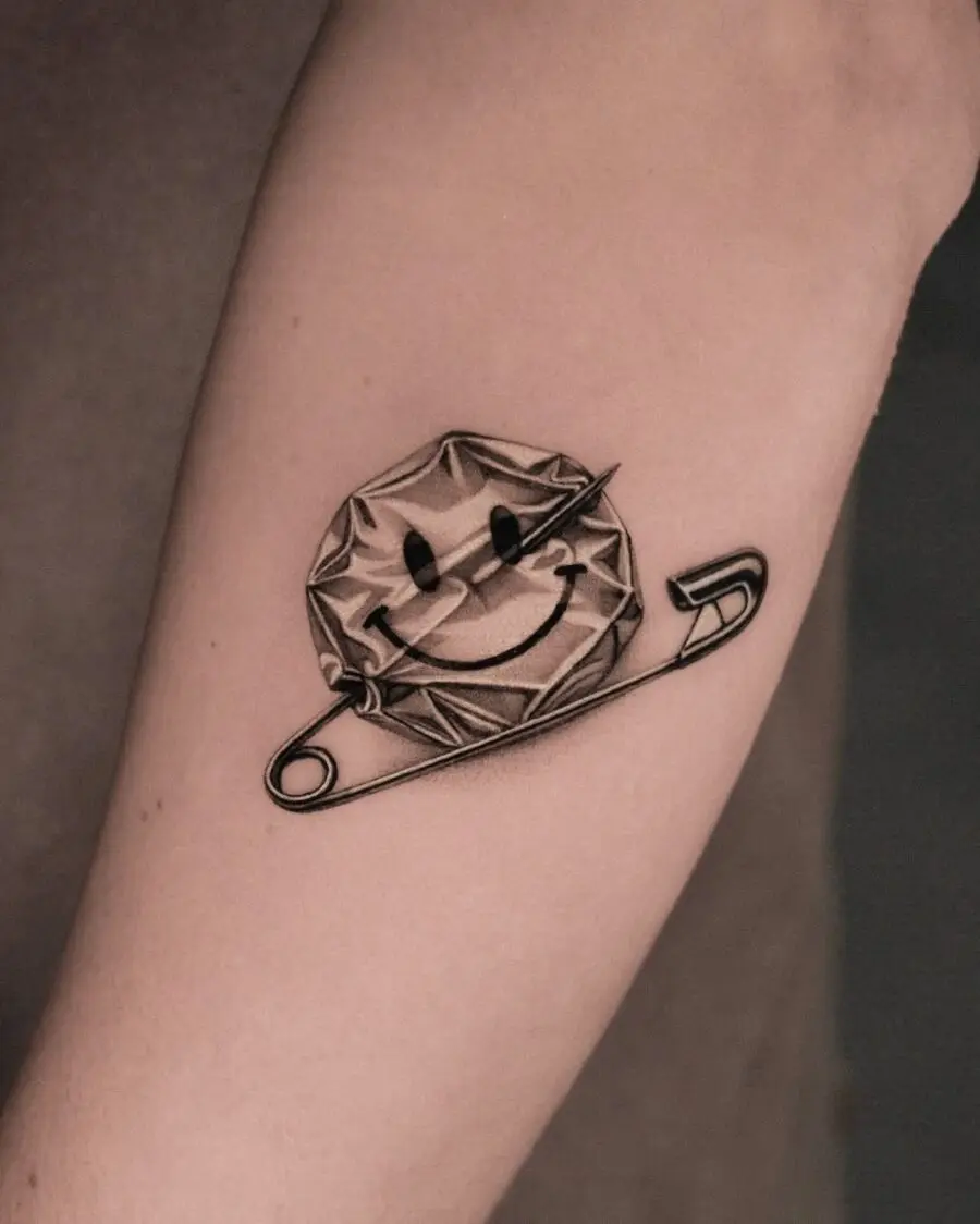 Playful smiley face tattoo with a twist