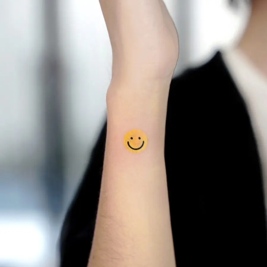 Charming Smiley Face Tattoo on Forearm