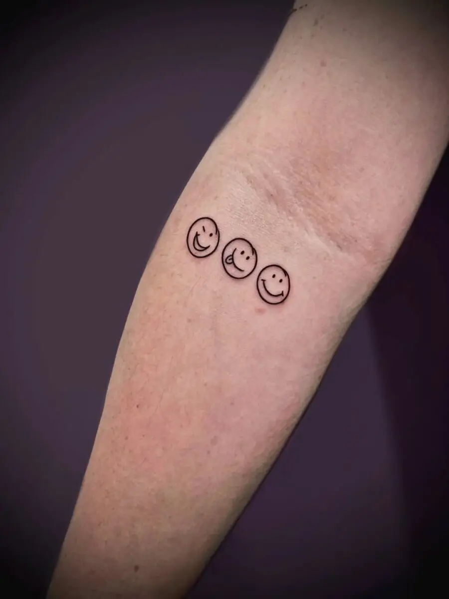 Charming smiley face tattoo trio design