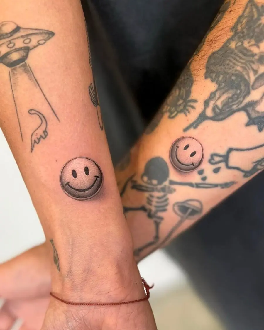 Playful smiley face tattoos on the forearm
