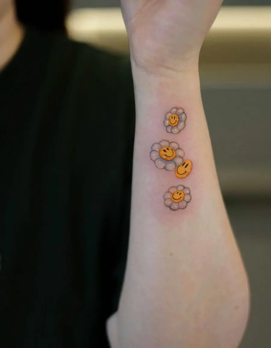 Vibrant smiley flower tattoos for cheerful vibes