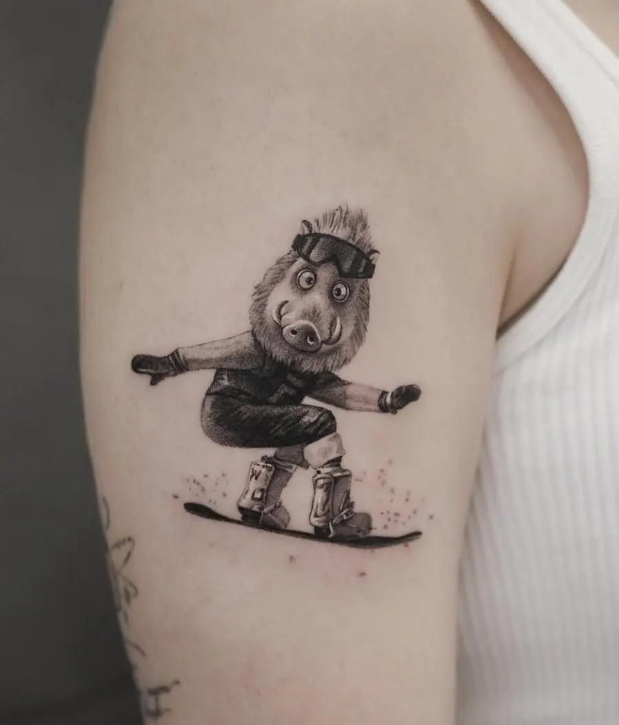 Whimsical tattoo of a cartoon snowboarder boar
