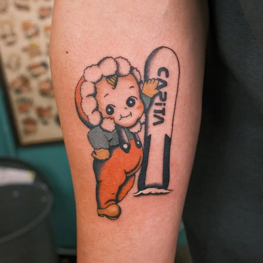 Unique cartoon character with snowboard tattoo
