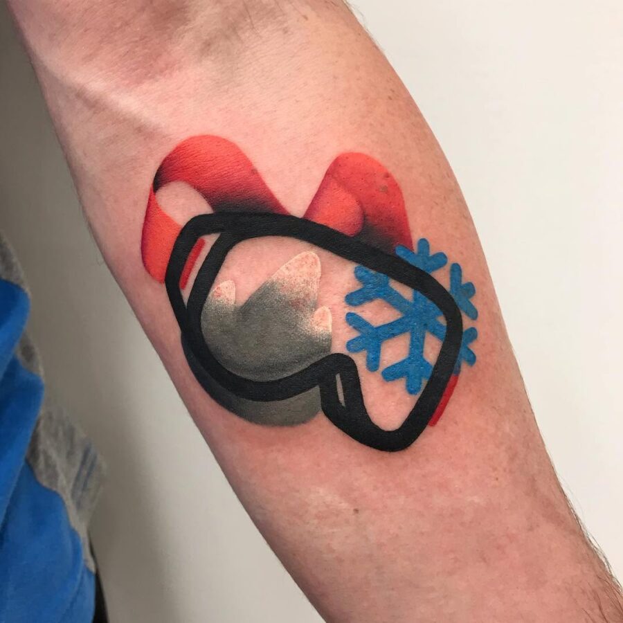 Stylish snowboard goggles tattoo with snowflake