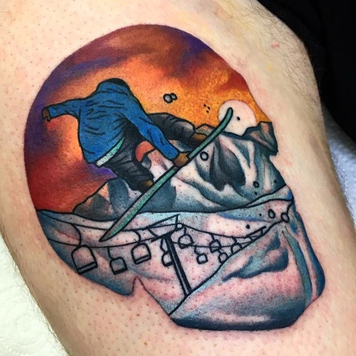 Dynamic snowboard tattoo with vibrant sunset colors