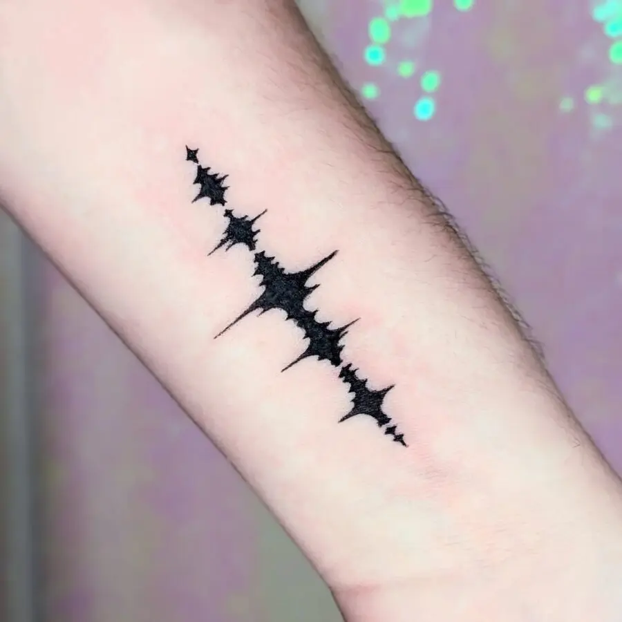 Minimalist Soundwave Tattoo Design on Forearm