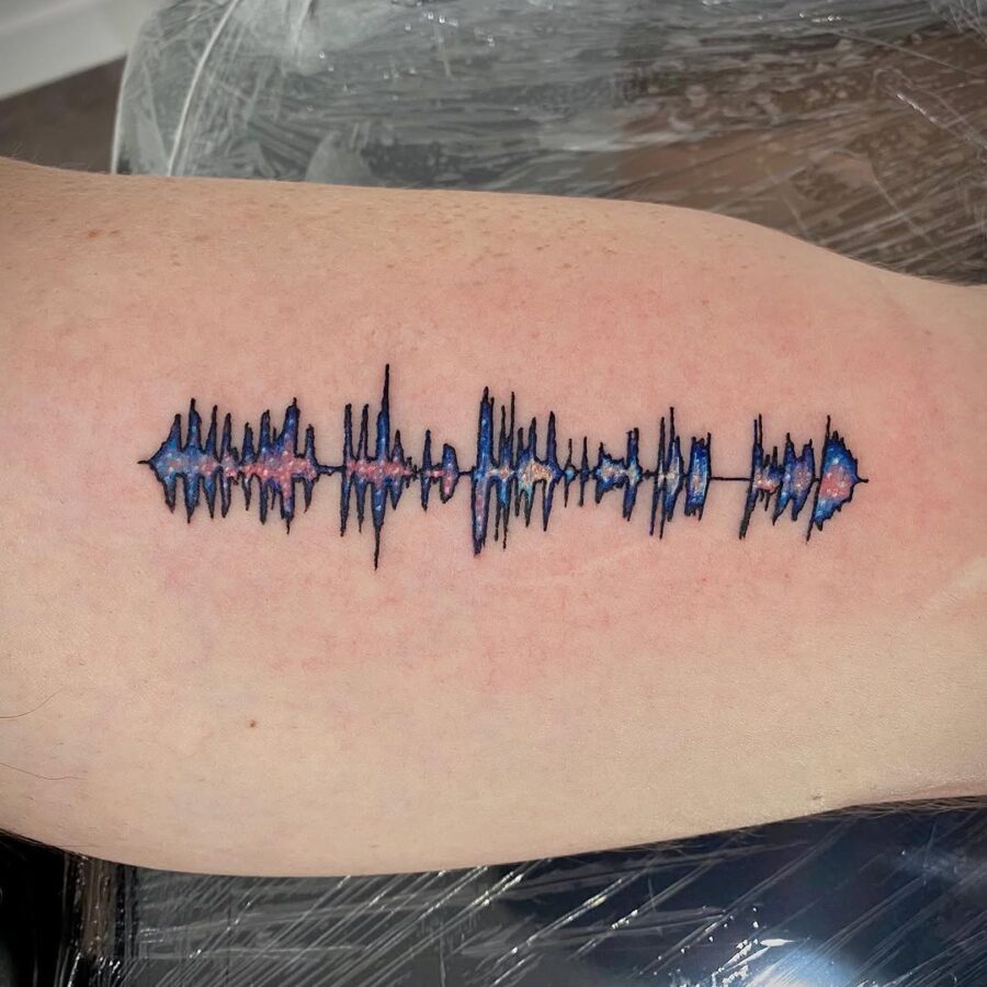 Vibrant soundwave tattoo showcasing unique artistry