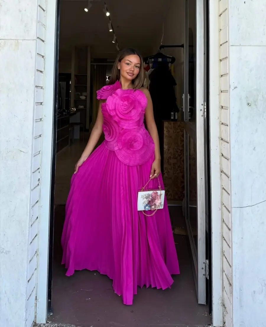 Fuchsia Dress with Floral Embellishments and Flowing Skirt